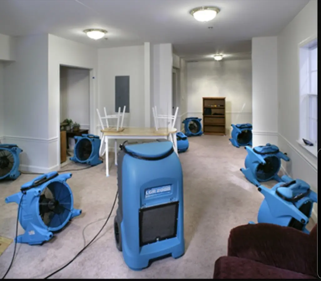 Air movers and dehumidifier setup for Water Damage Restoration in Plumsted